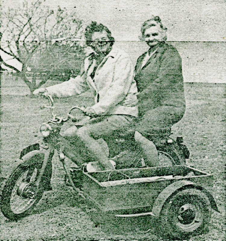 Mrs-Burton-and-Mrs-Cutton-on-bike-happy-valley-creased-photo